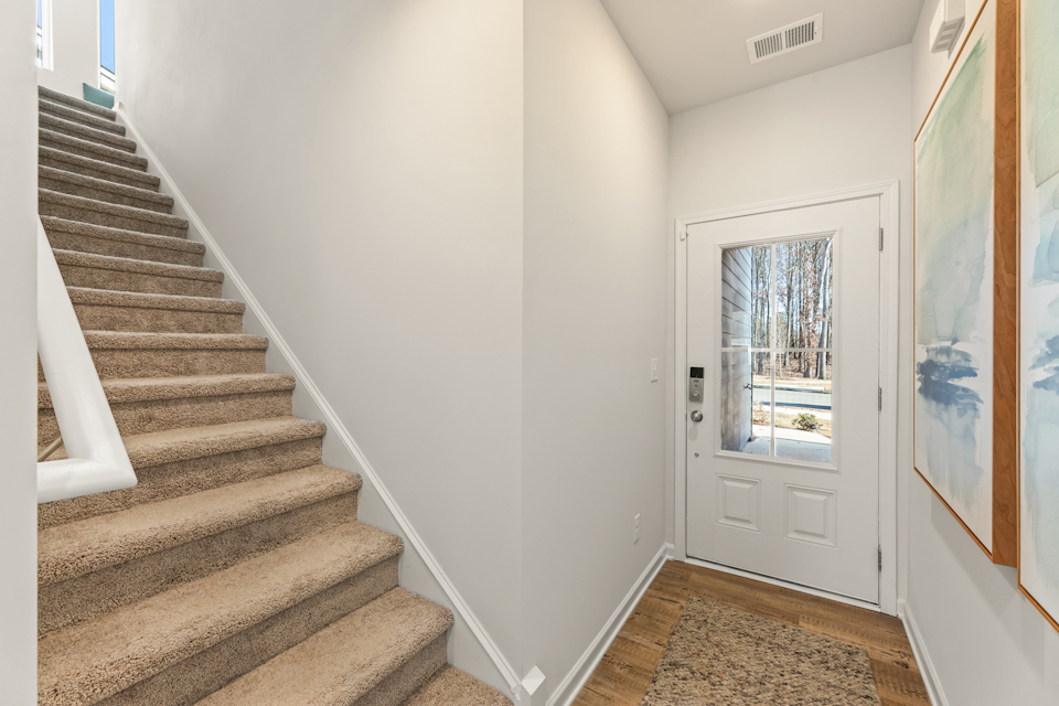 A staircase leading to a door.