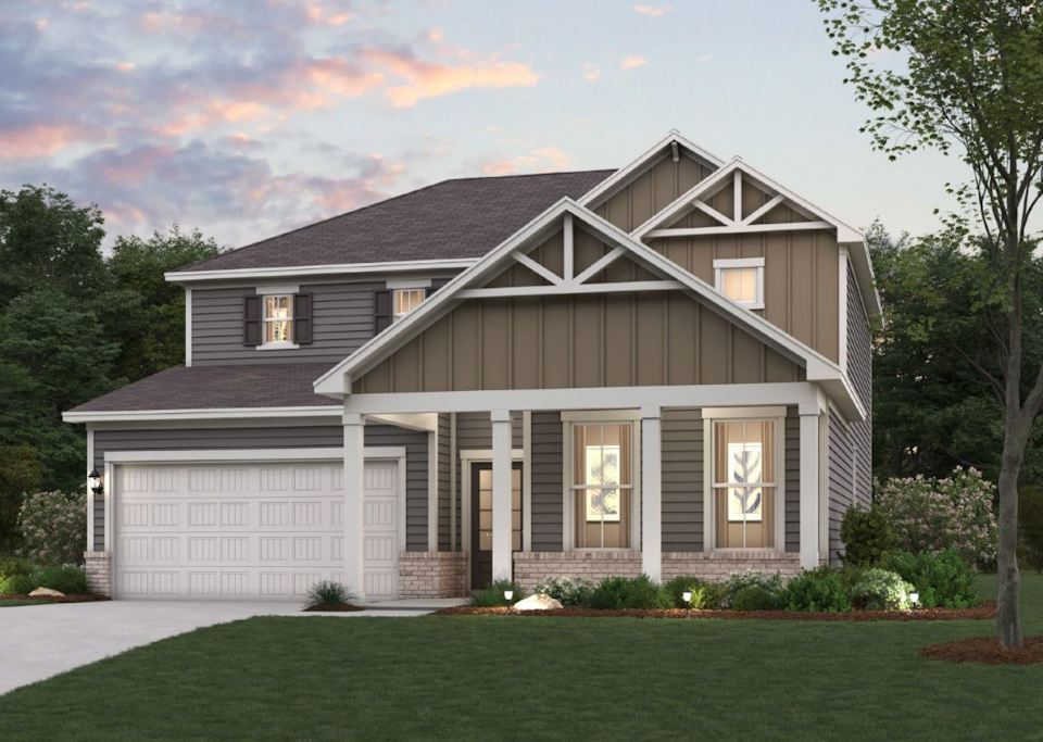 A house with a lawn in front of it.