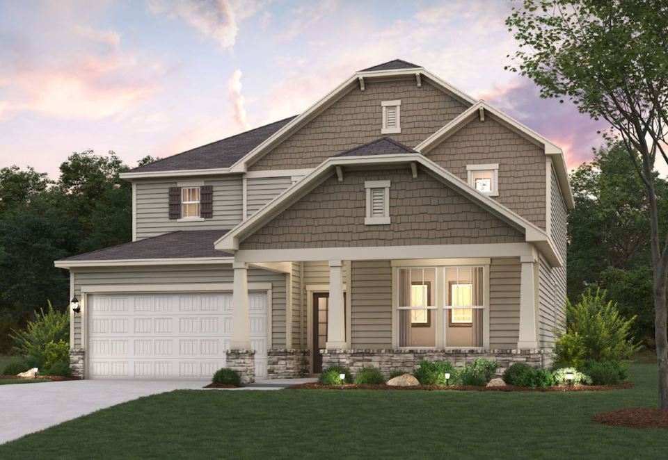 A house with a lawn in front of it.