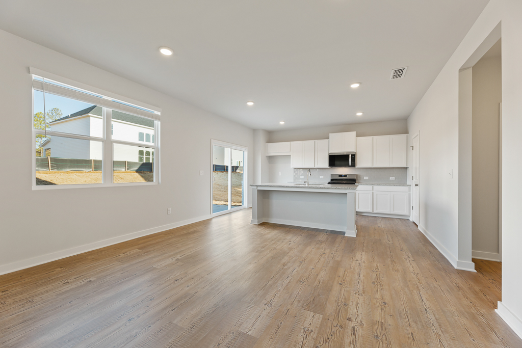 A large kitchen with white cabinets.
