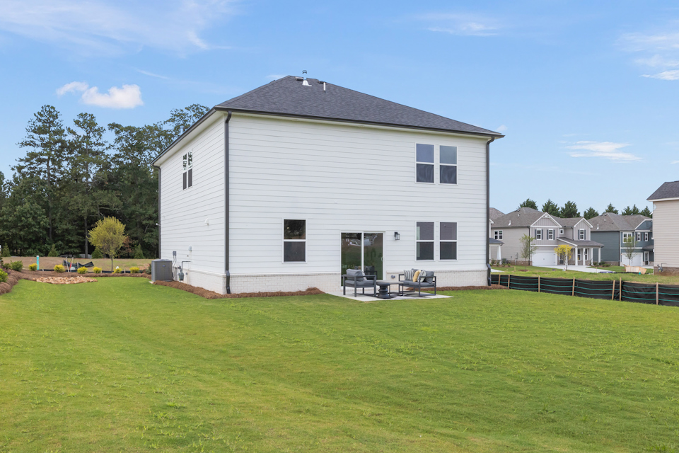 A house with a lawn in front of it.