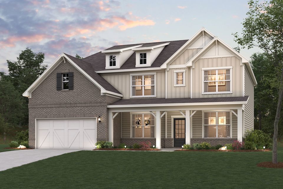 A house with a lawn in front.
