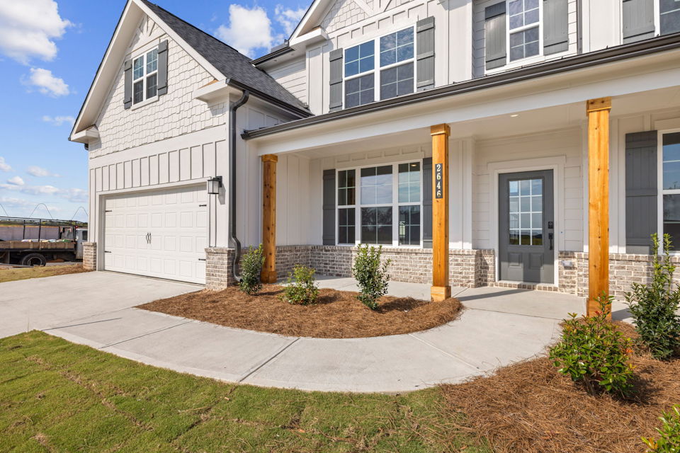 A building with a front yard.