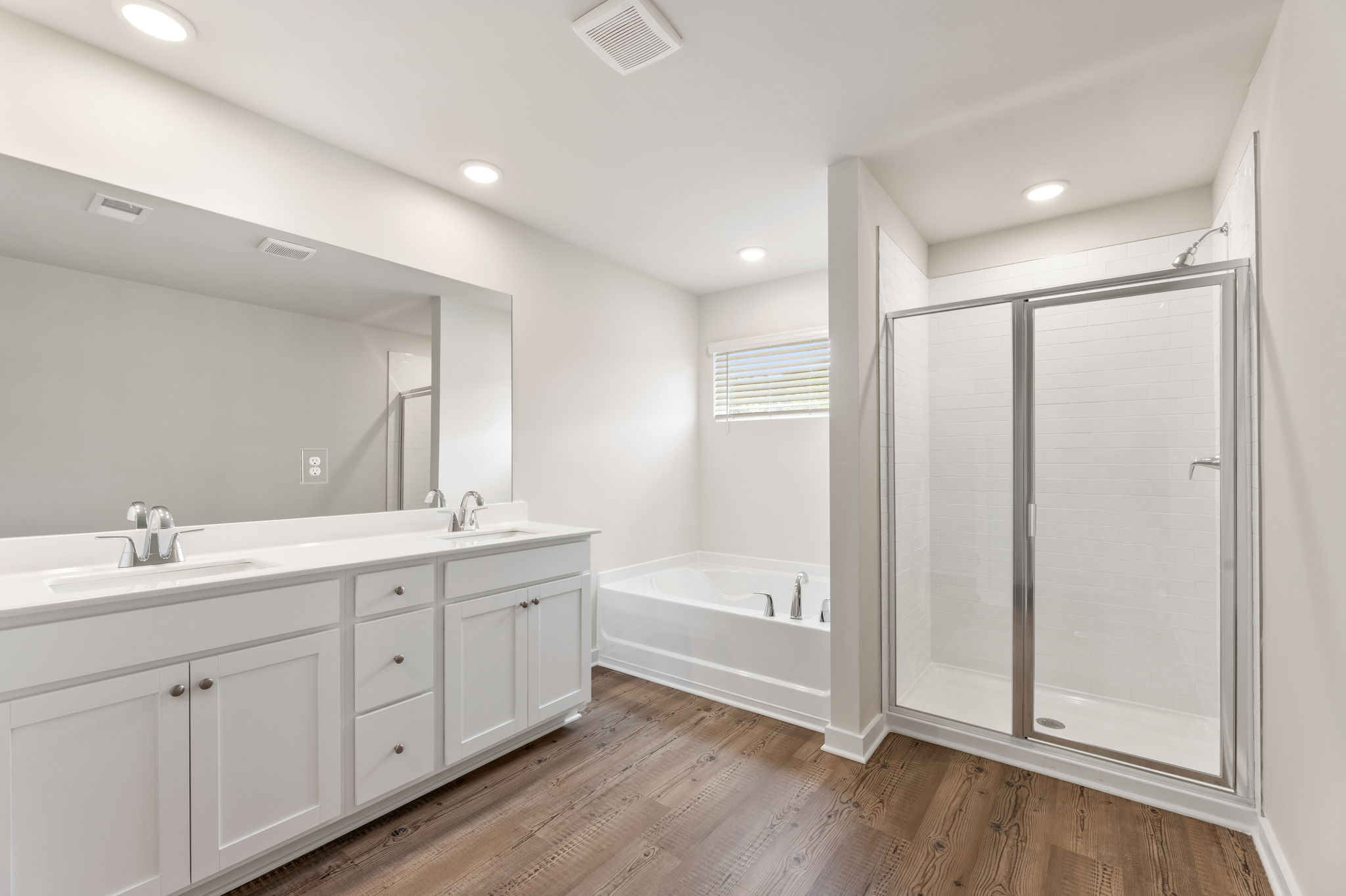 A bathroom with a tub and sink.