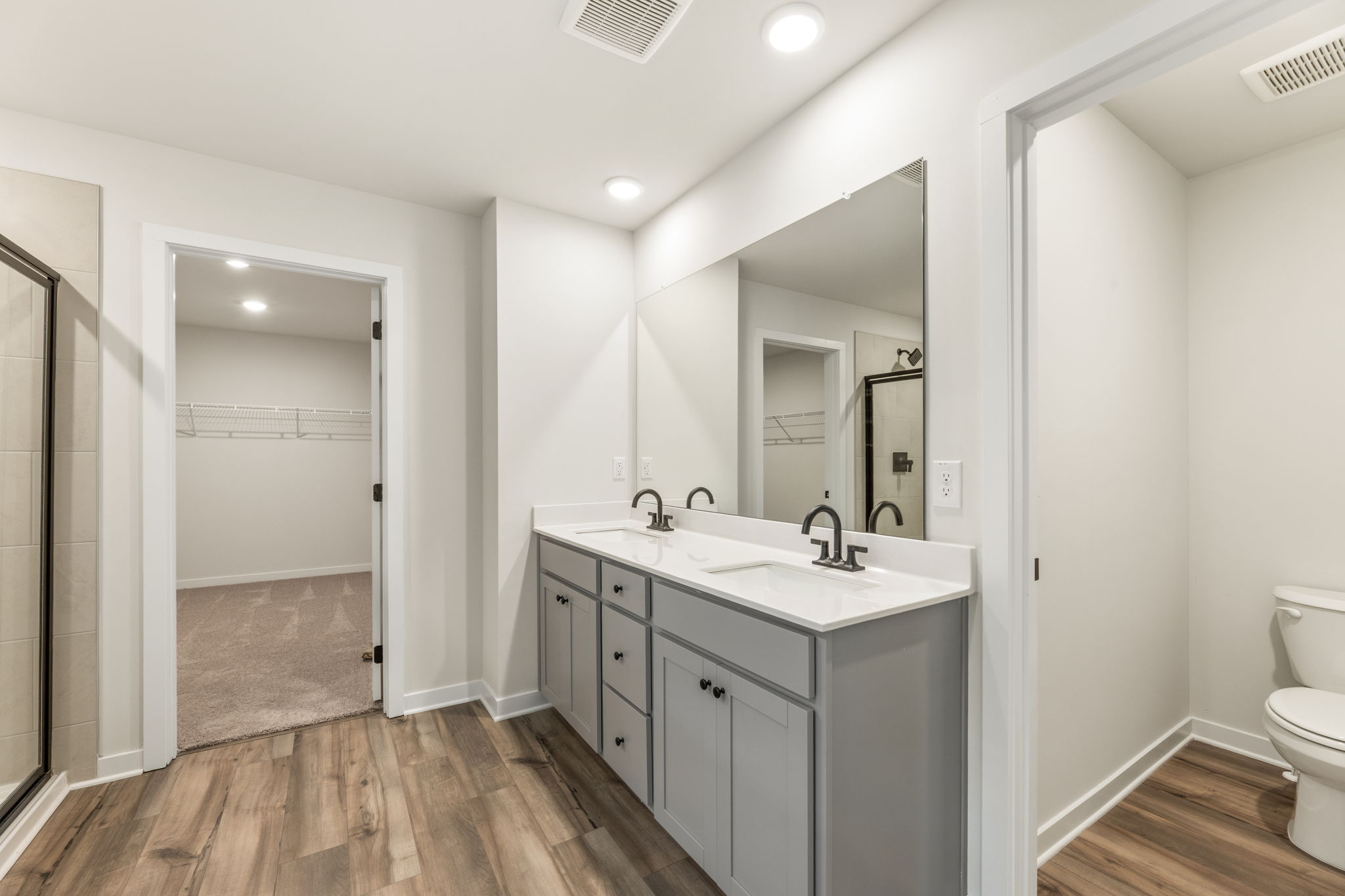 A bathroom with a sink and a toilet.