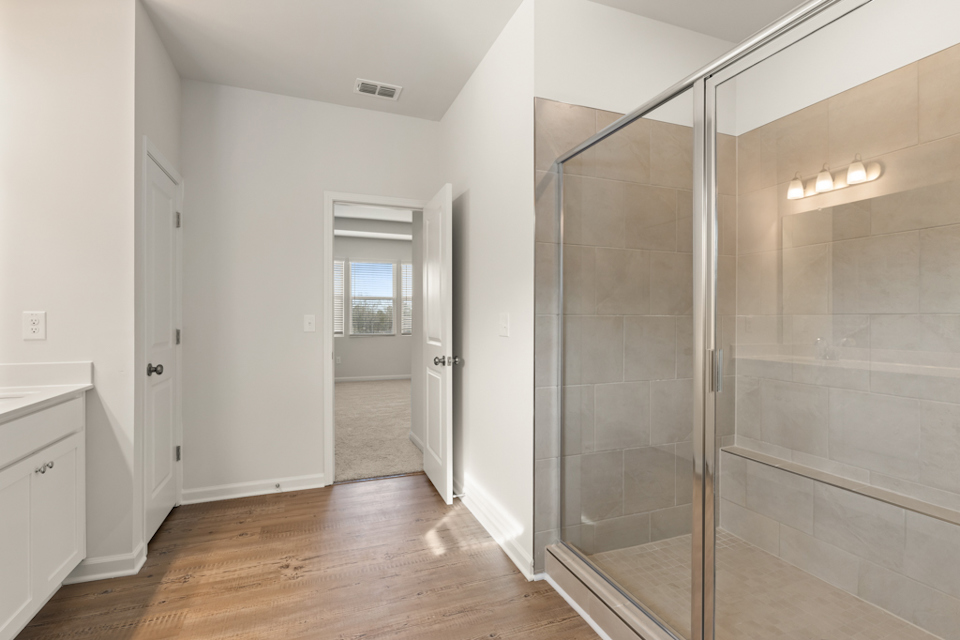 A bathroom with a glass shower.