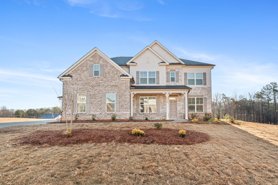 A house with a dirt yard.