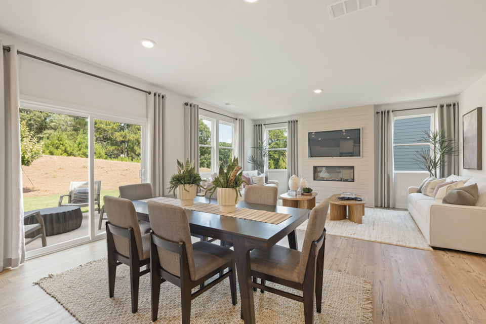 A dining room with a large window.