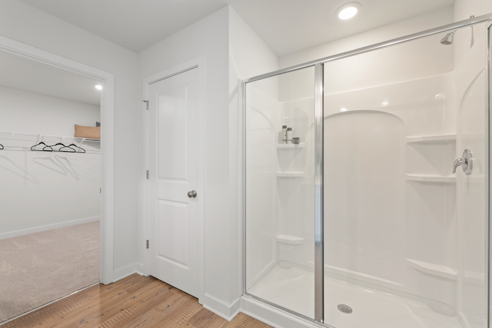 A bathroom with a glass shower.