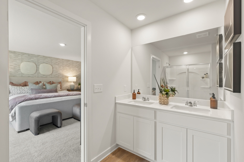 A bathroom with a large mirror.