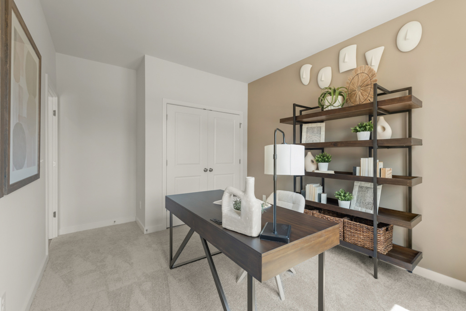 A room with a table and shelves.