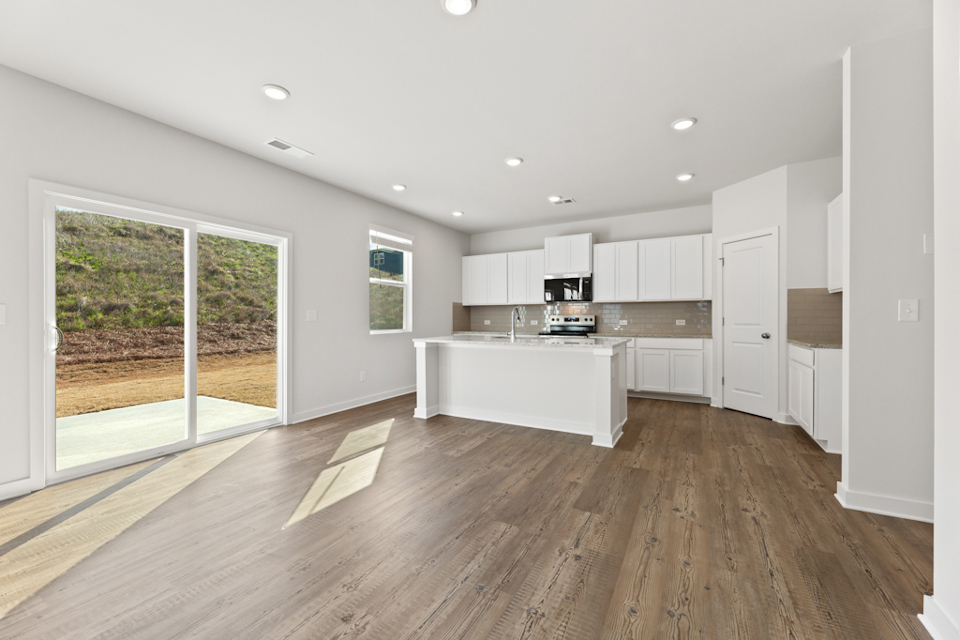 A large kitchen with white cabinets.