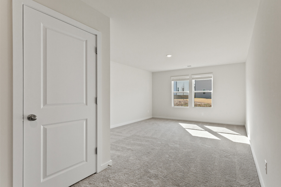 A room with a door and a window.