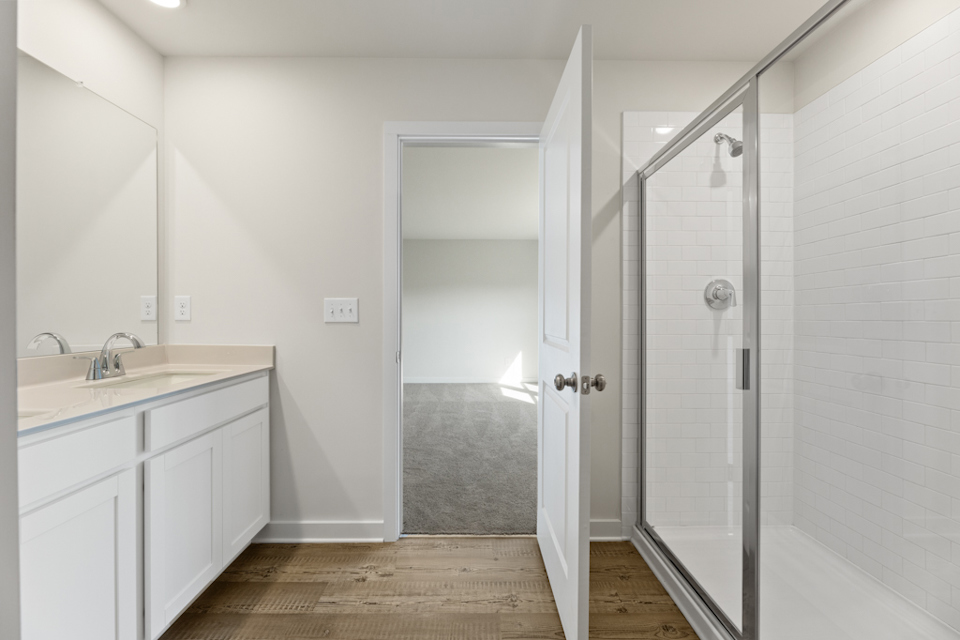 A bathroom with a glass shower.