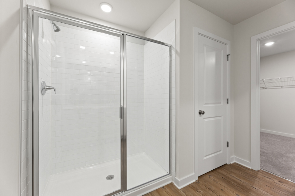 A bathroom with a glass shower.