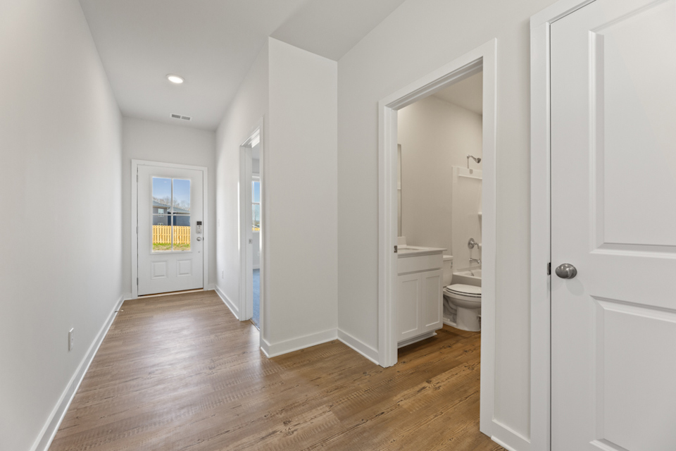 A bathroom with white walls.