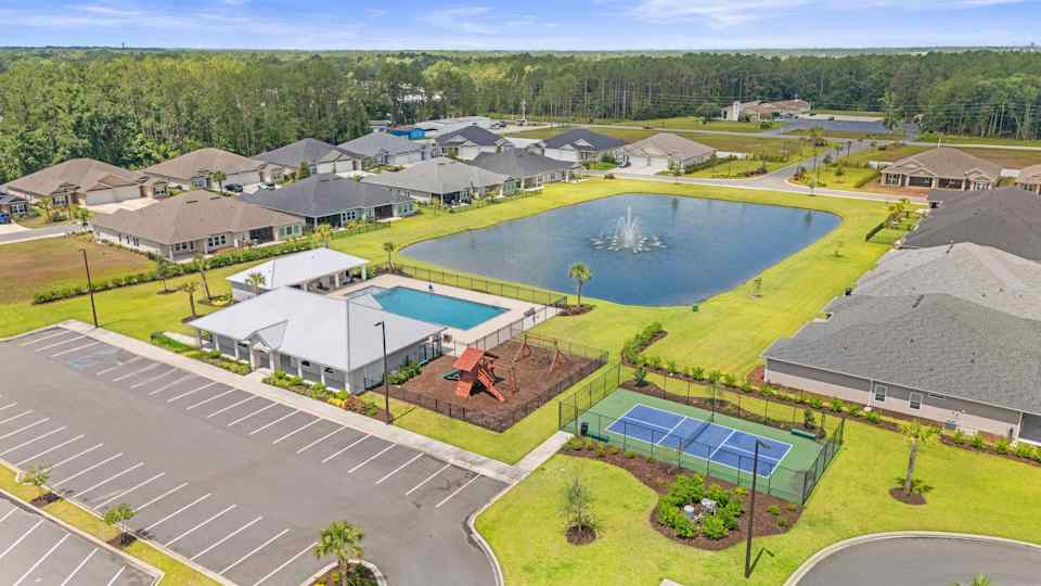 Camden Woods Amenity Clubhouse with Pool, Playground, and Pond seen from above in Kingsland, GA