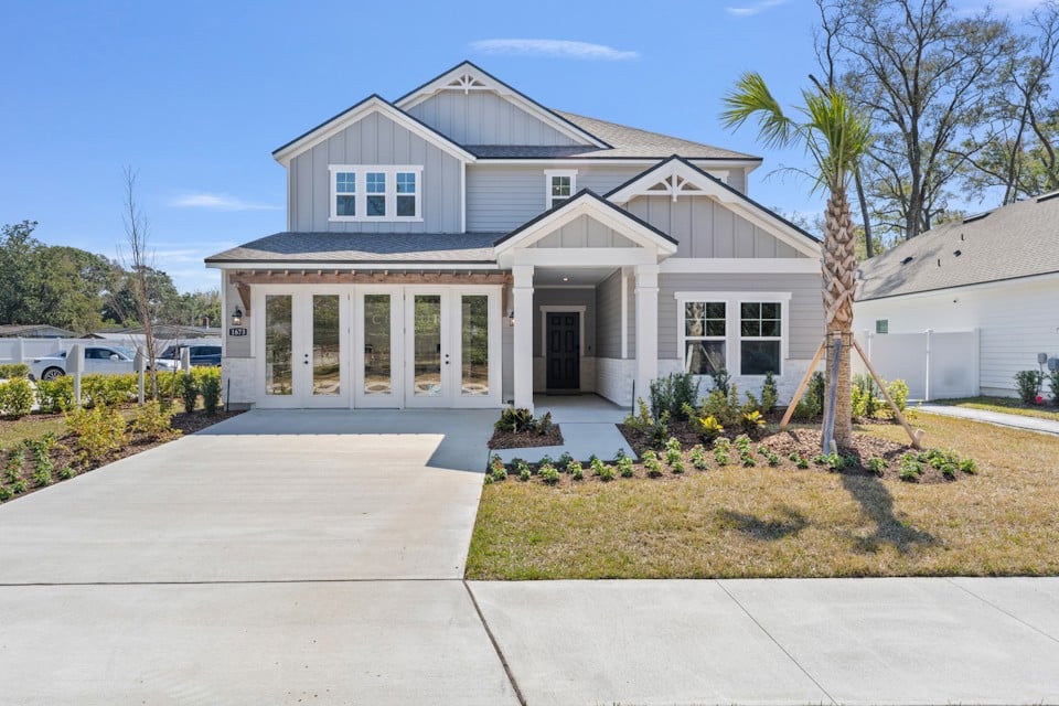 A white house with a driveway.