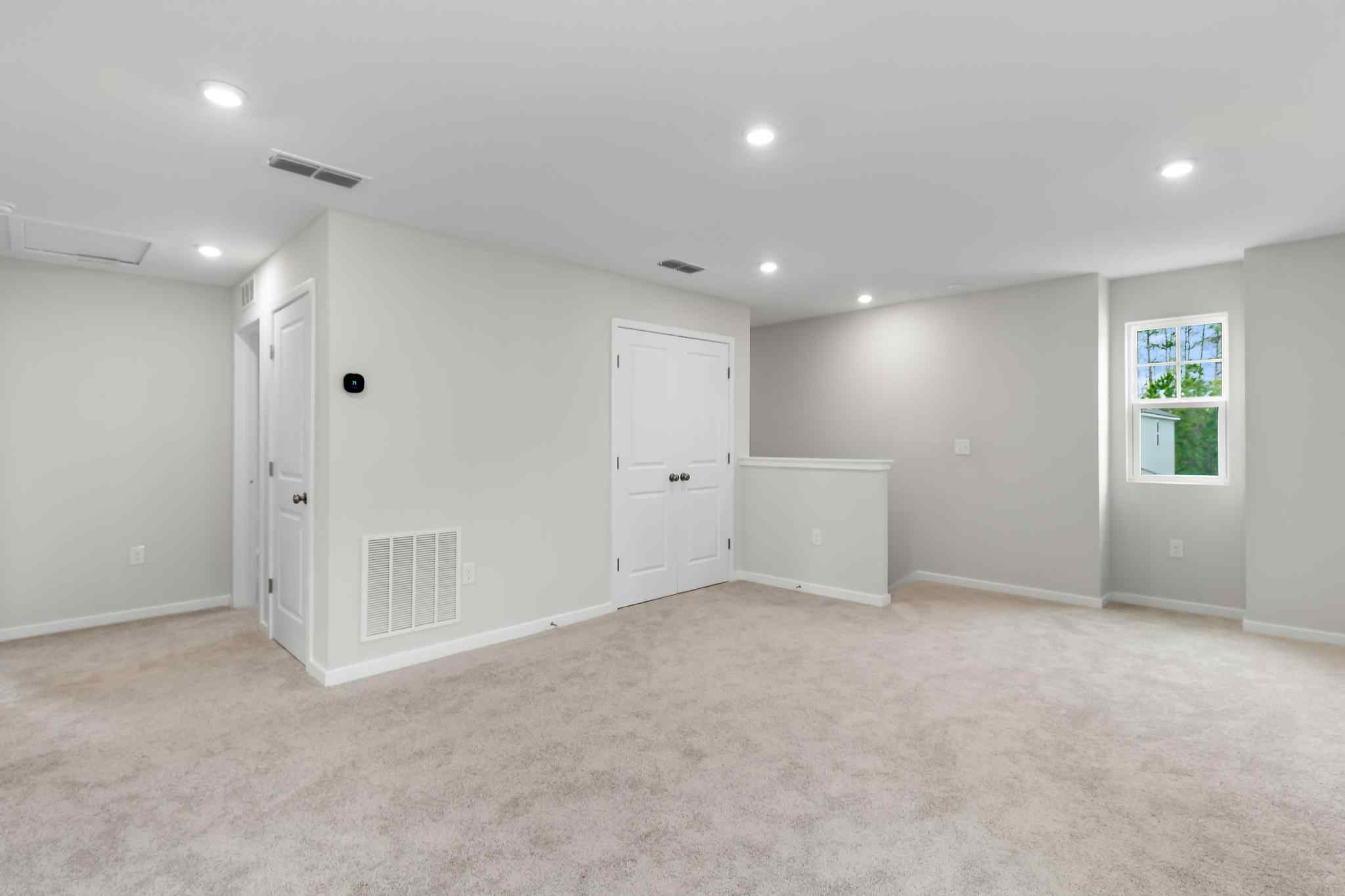 A room with white cabinets.