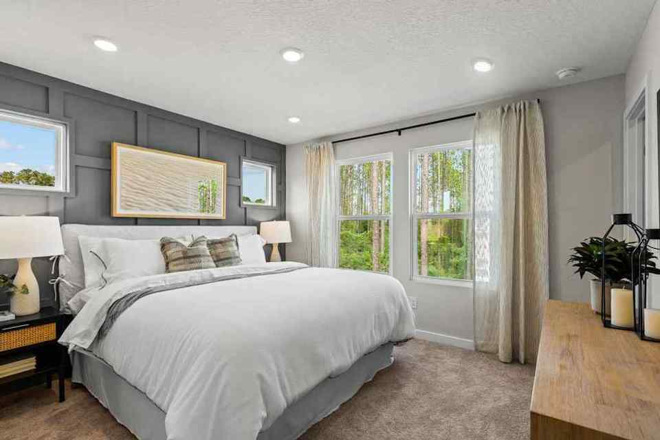 A bedroom with a large bed.
