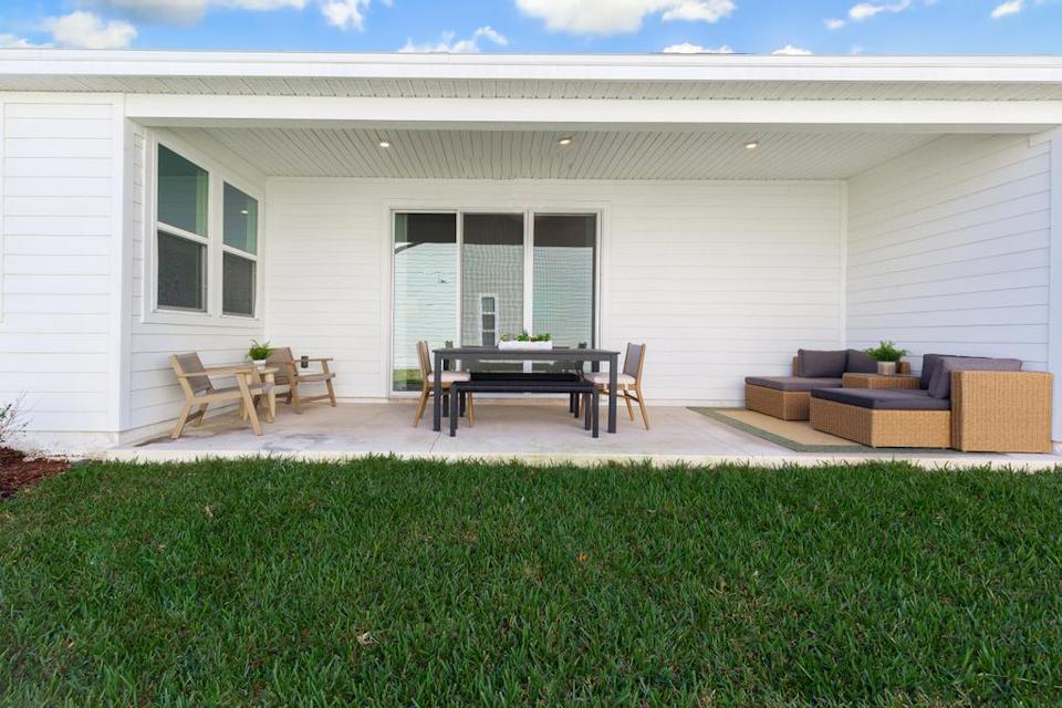 A house with a large lawn.