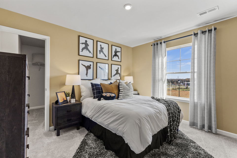 A bedroom with a large bed.