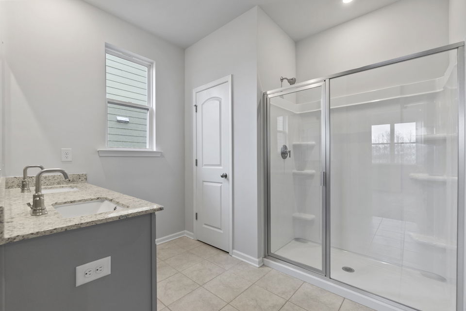 A bathroom with a glass shower.