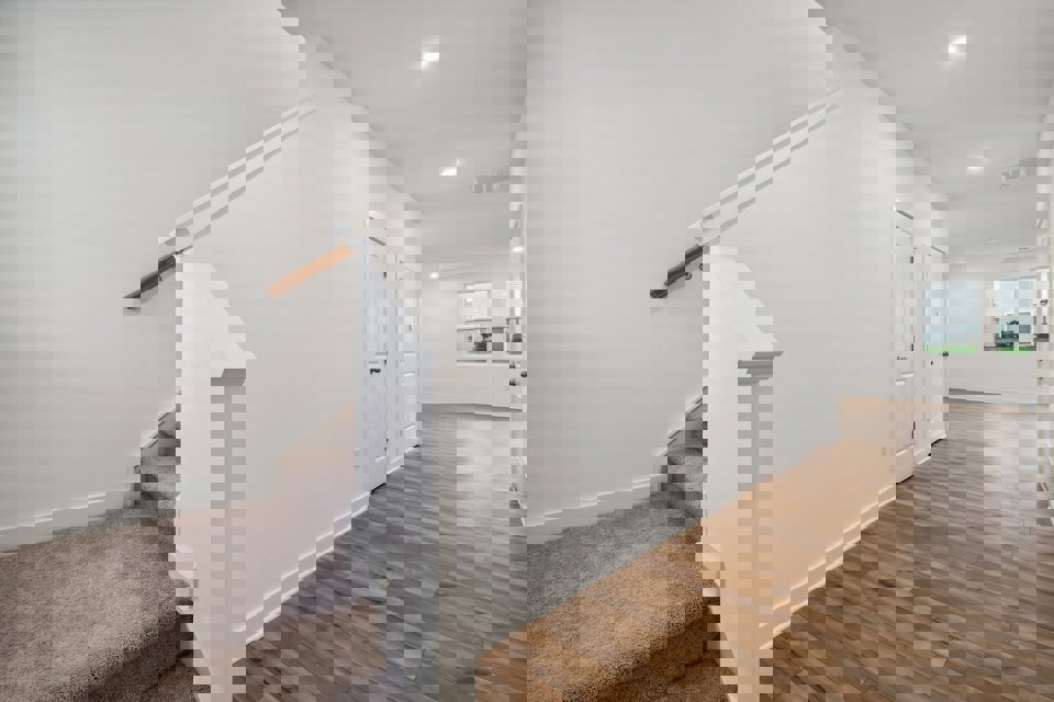 A white staircase in a room.