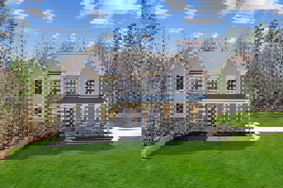 A house with a large front yard.