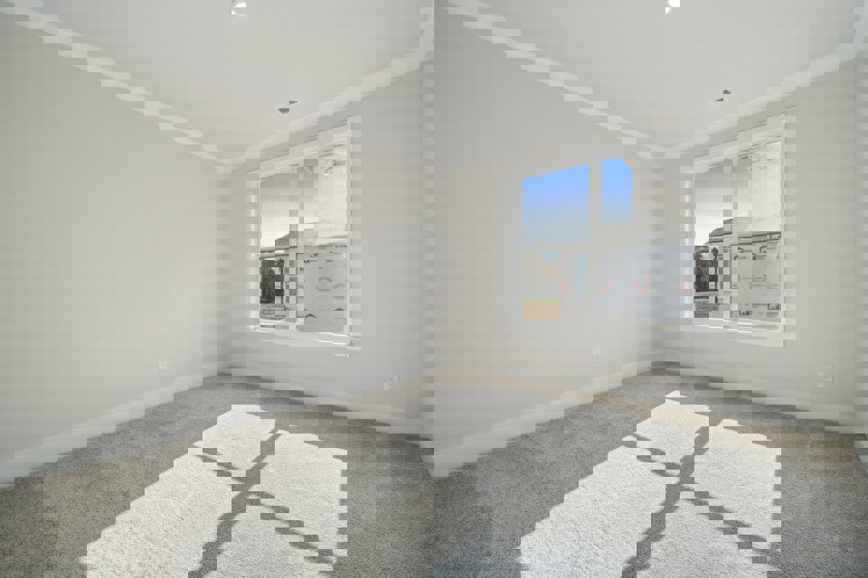 A room with a window and a tile floor.
