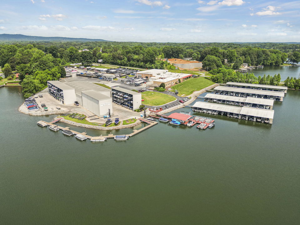A body of water with buildings and trees around it.