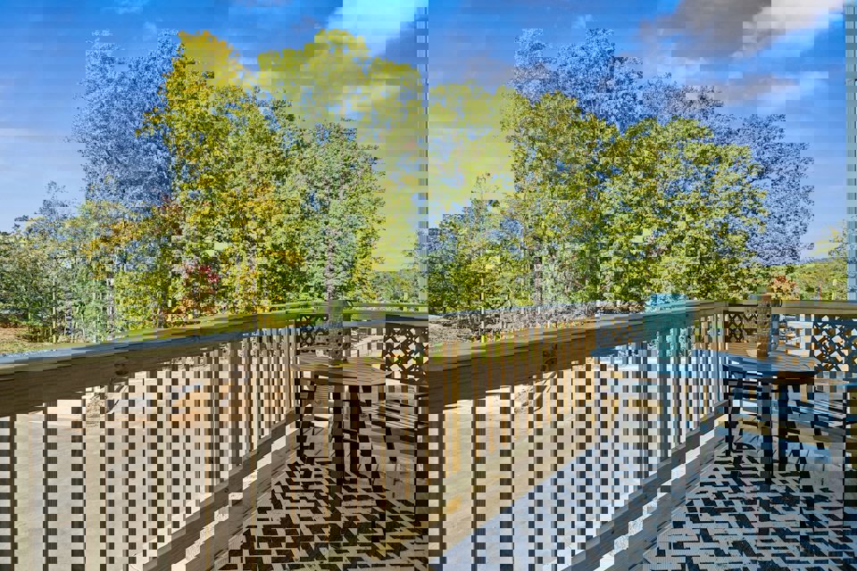 A table and chairs on a deck.