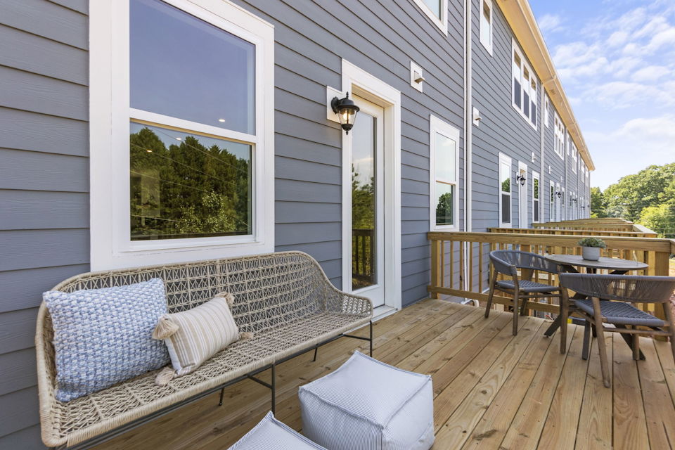 A deck with a table and chairs.