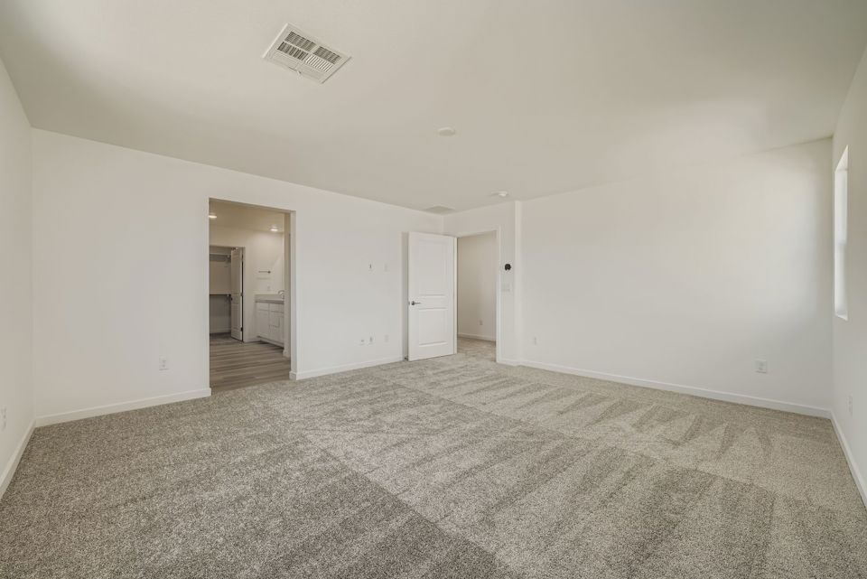 A hallway with white walls.