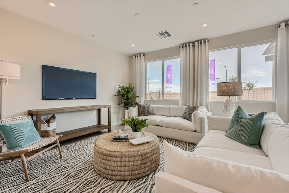 A living room with a large window.