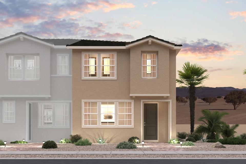 A large house with a palm tree.