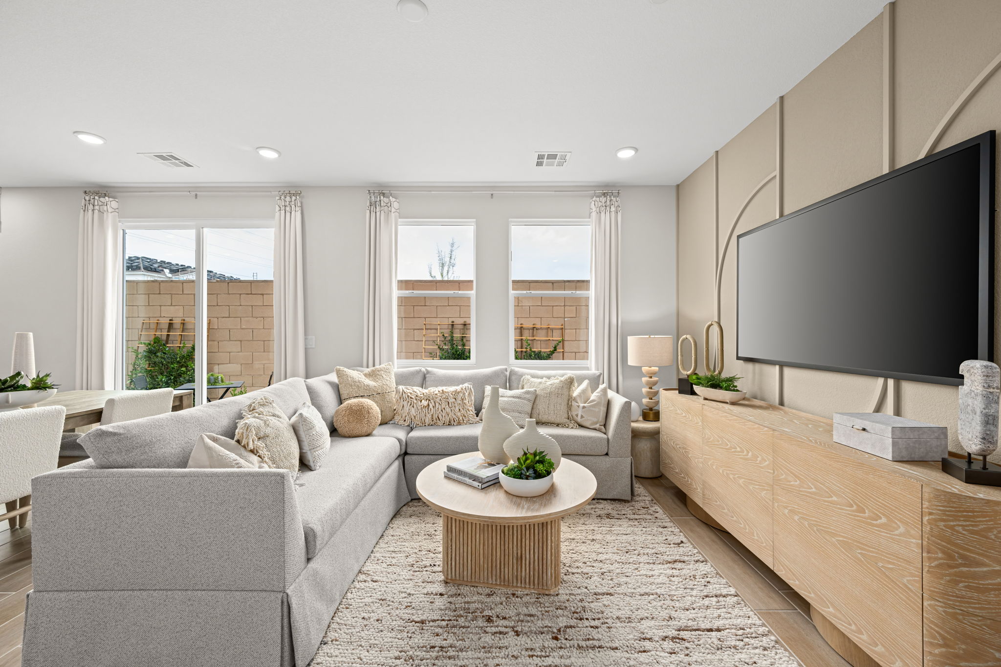 A living room with a tv and couches.