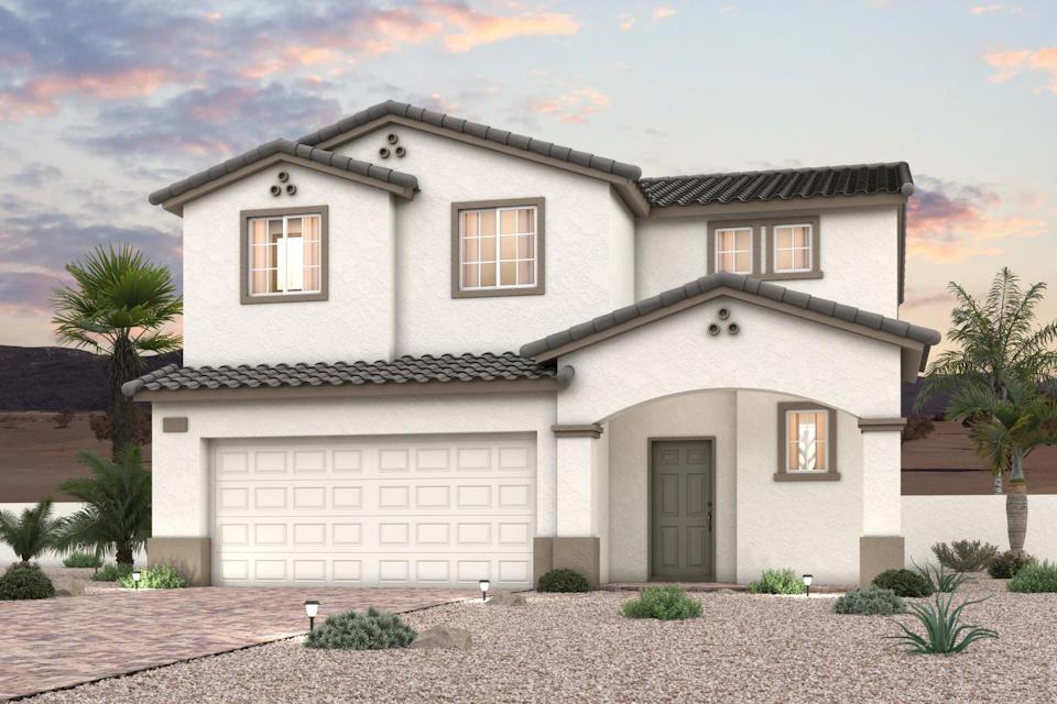 A white house with a garage.