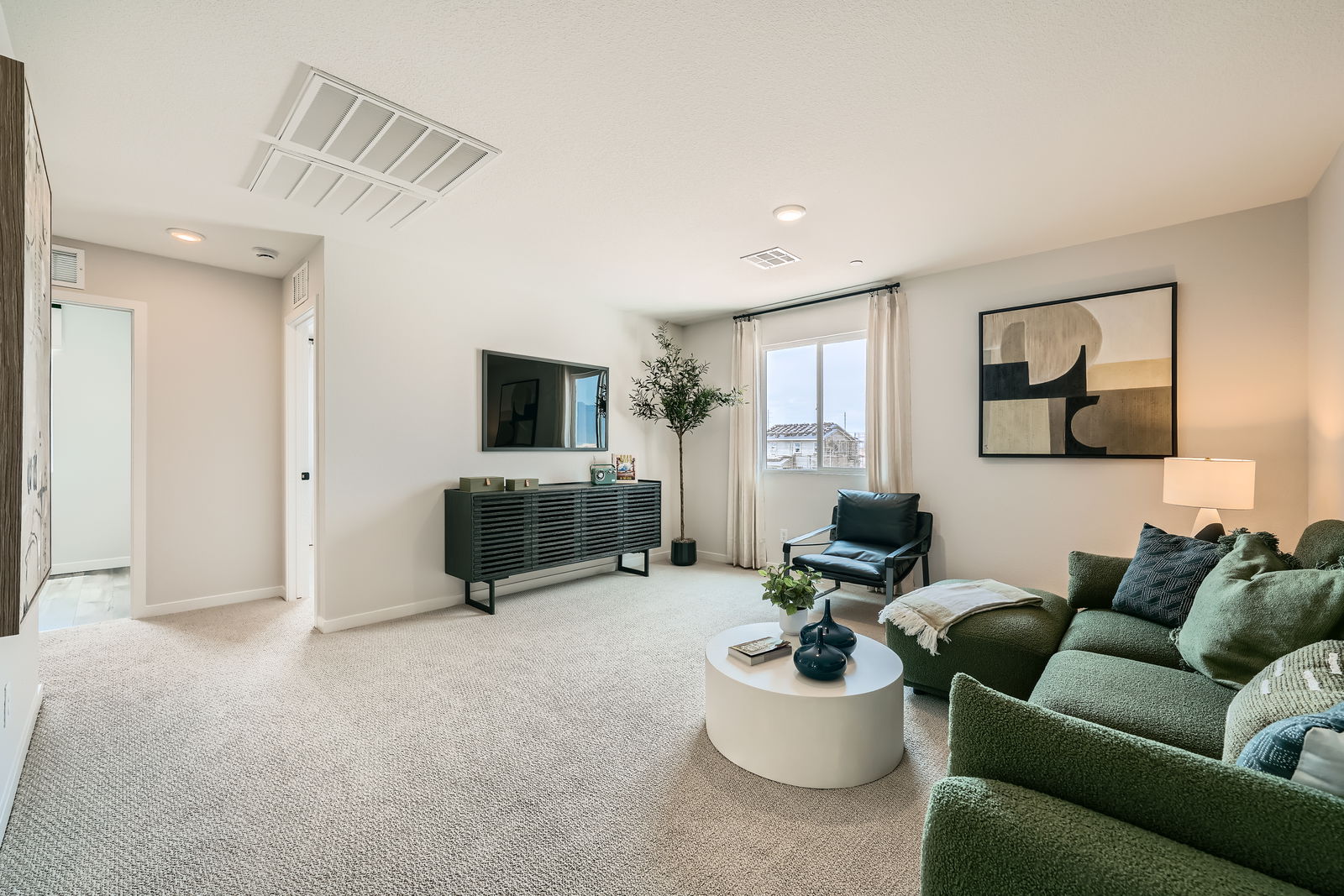 A living room with a couch and a coffee table.