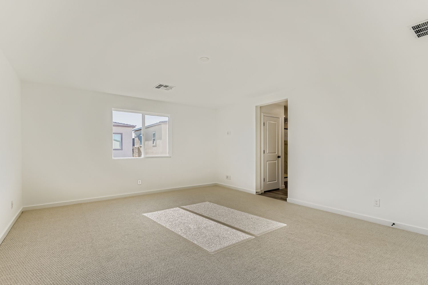 A room with a rug and a rug.