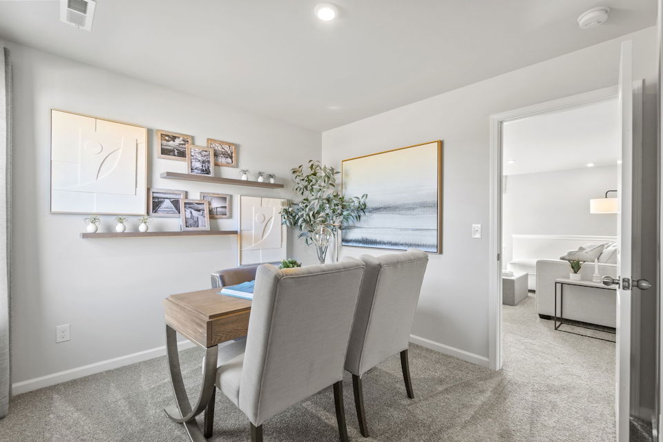 A room with a desk and chair.