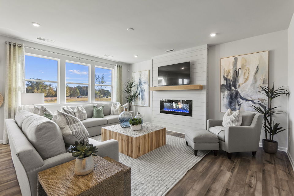 A living room with a fireplace.