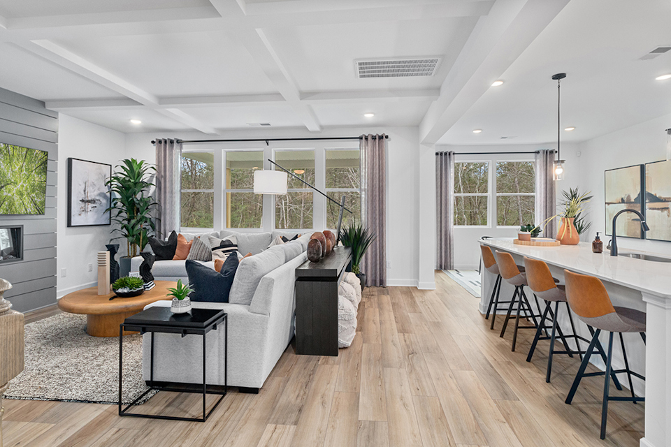 A living room with a couch and a table.