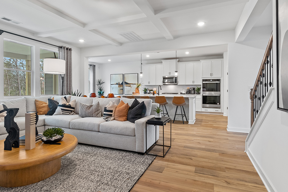 A living room with a couch and a table.