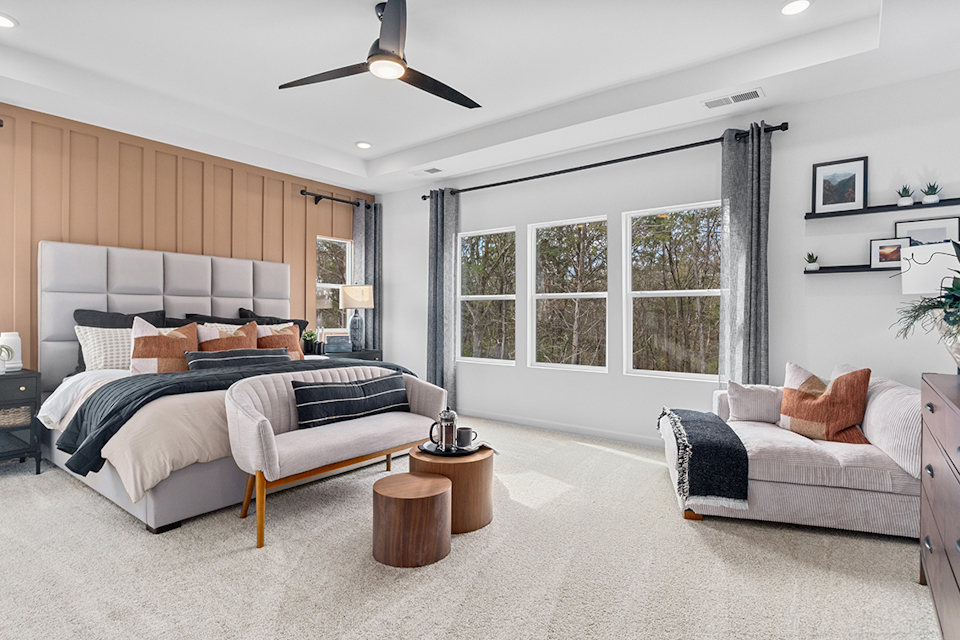 A bedroom with a bed and a couch.