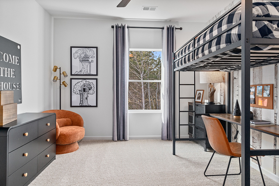 A room with a table and chairs.