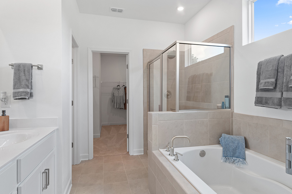 A bathroom with a tub and sink.