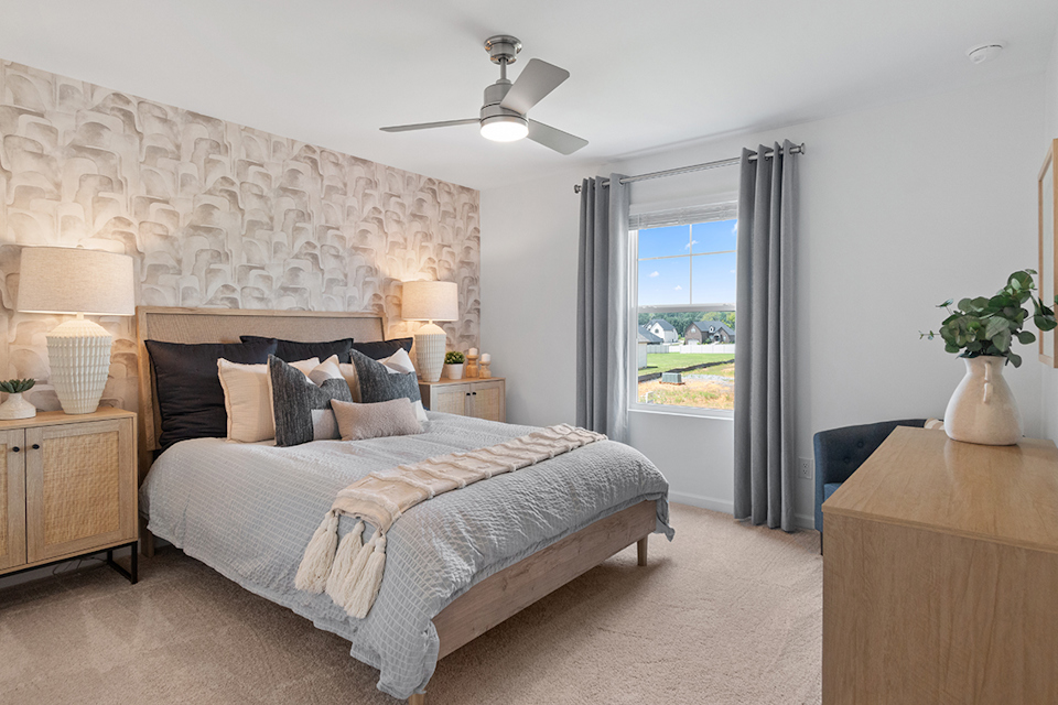 A bedroom with a large bed.