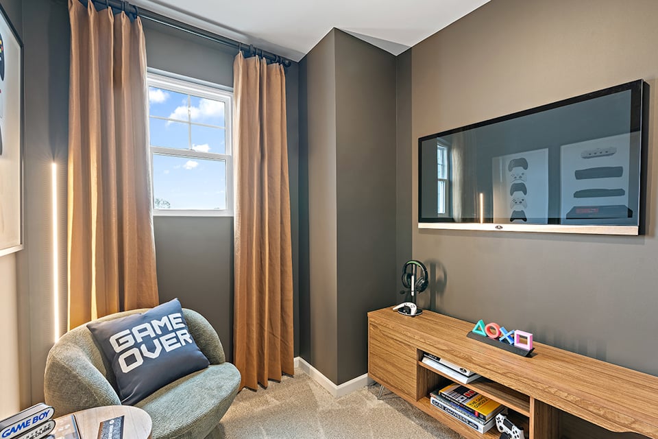 A living room with a tv and a couch.