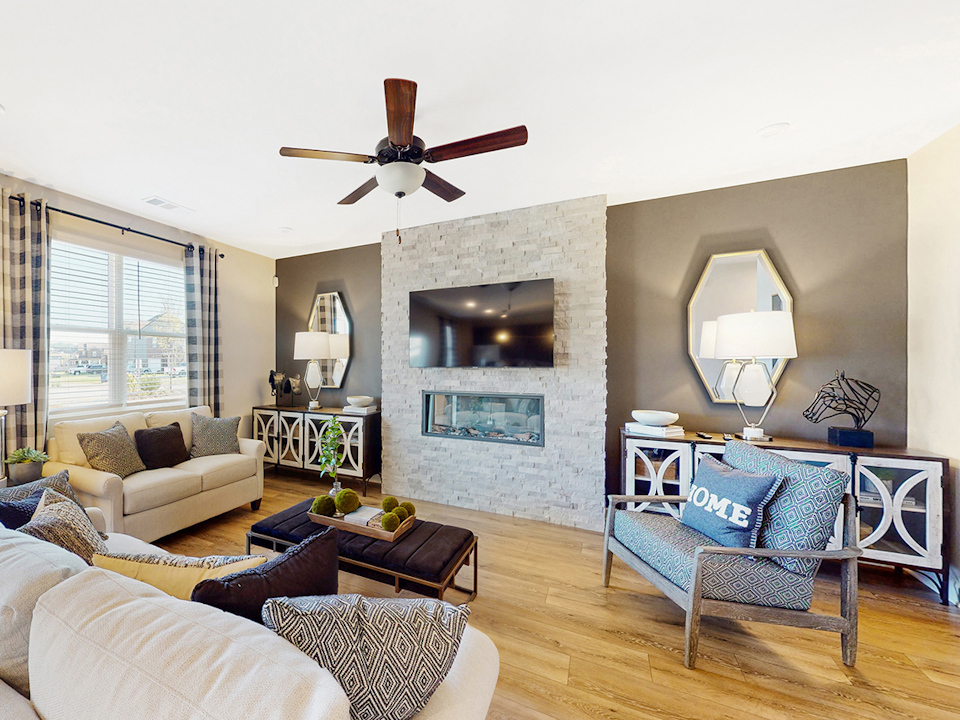 A living room with a fireplace.